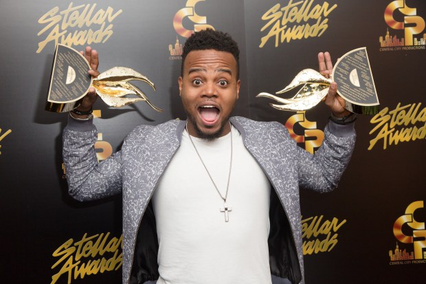 Travis Greene with two of his Stellar Awards
